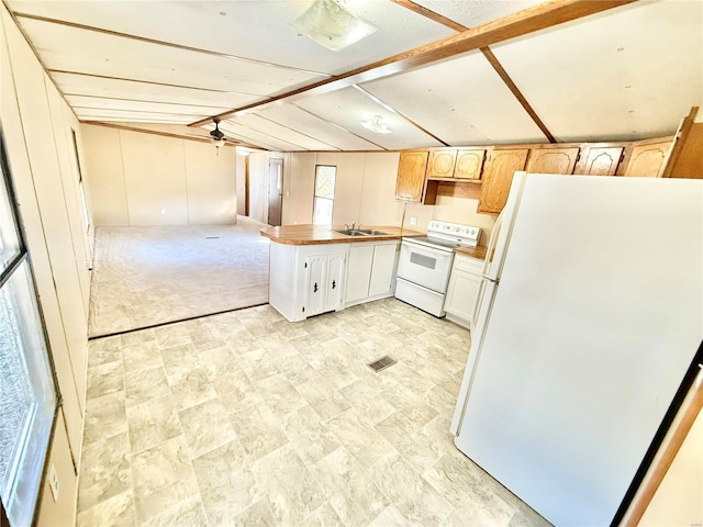 kitchen with white appliances, lofted ceiling with beams, sink, light brown cabinetry, and white cabinetry