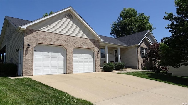 ranch-style home with a front yard and a garage