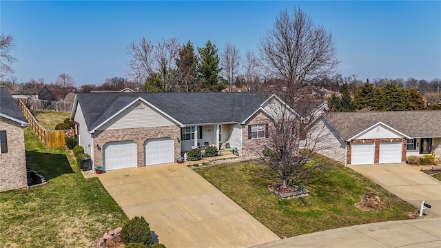 ranch-style house with brick siding, an attached garage, fence, a front yard, and driveway