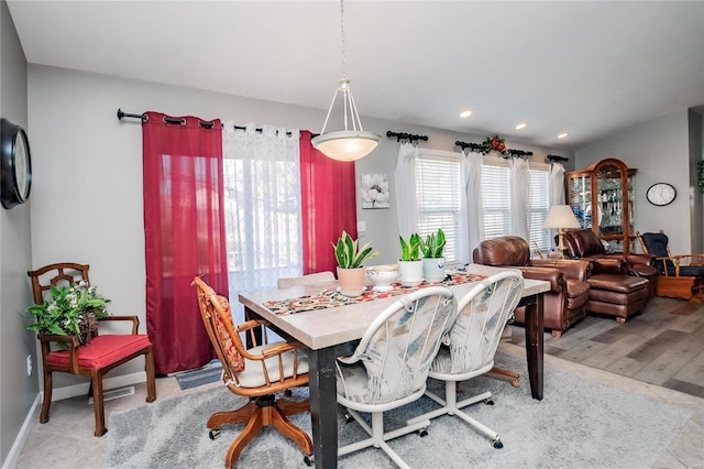 dining area with recessed lighting and baseboards