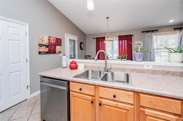 kitchen with light tile patterned floors, lofted ceiling, a sink, light countertops, and dishwasher