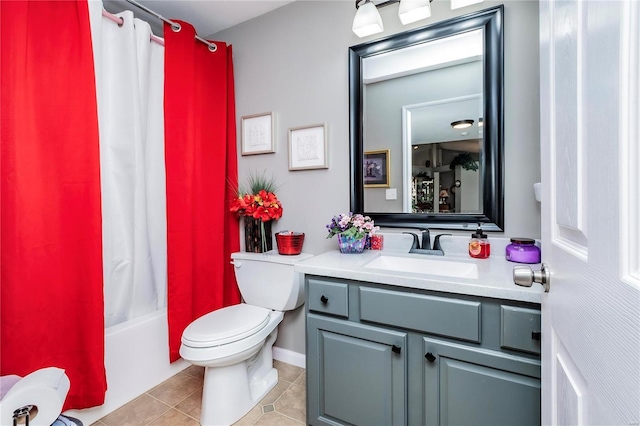 bathroom featuring toilet, shower / tub combo with curtain, vanity, and tile patterned flooring