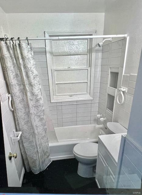 full bathroom featuring vanity, shower / bath combination with curtain, and toilet