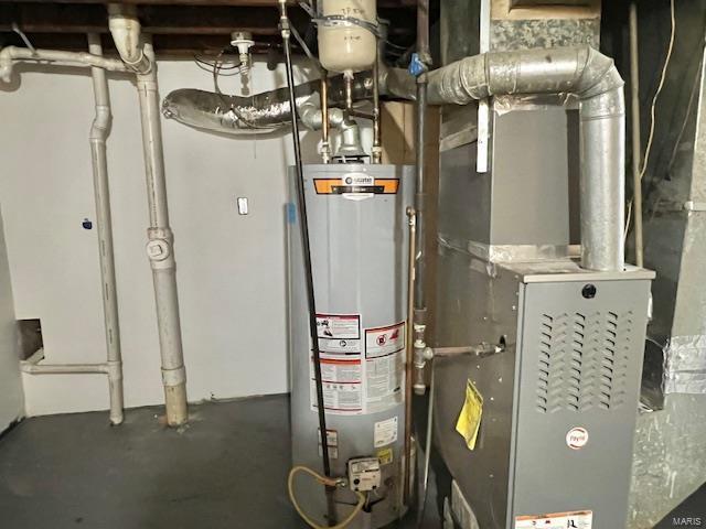 utility room with heating unit and gas water heater