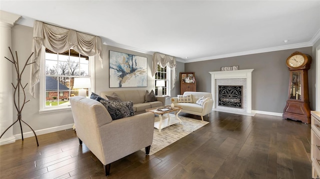 living room featuring ornamental molding, a brick fireplace, and dark wood-type flooring