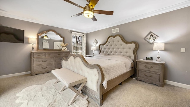 bedroom with light carpet, ceiling fan, and crown molding