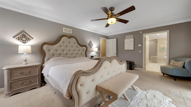 bedroom featuring light carpet, ensuite bath, ceiling fan, and ornamental molding