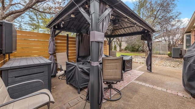 view of patio / terrace featuring a gazebo, area for grilling, and central AC unit