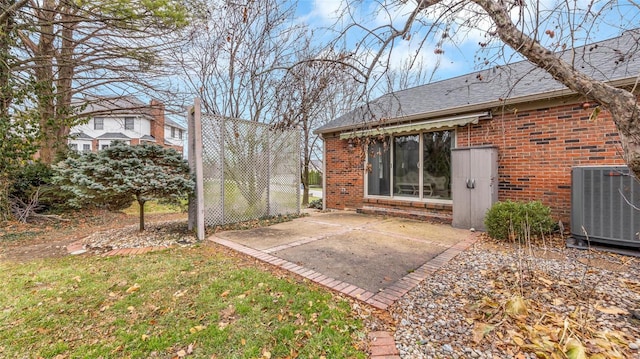 rear view of house with a patio area and central air condition unit