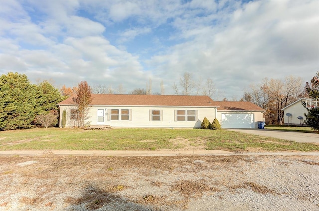 single story home with a garage and a front yard