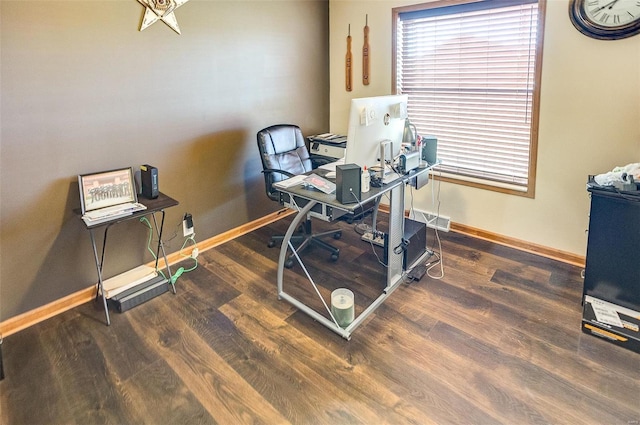 home office with dark wood-type flooring