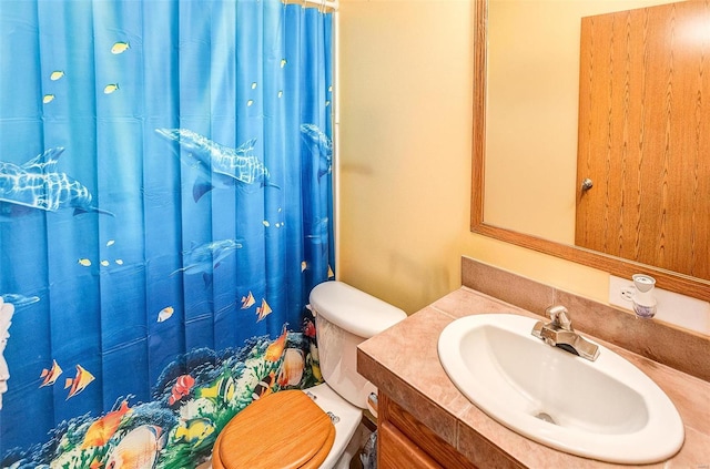 bathroom with vanity and toilet