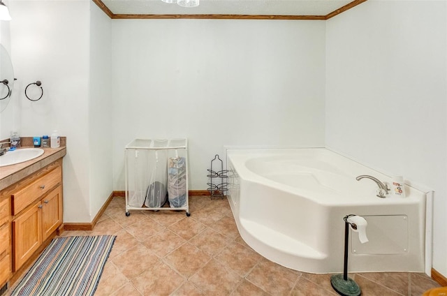 bathroom with a bathing tub, vanity, ornamental molding, and tile patterned flooring