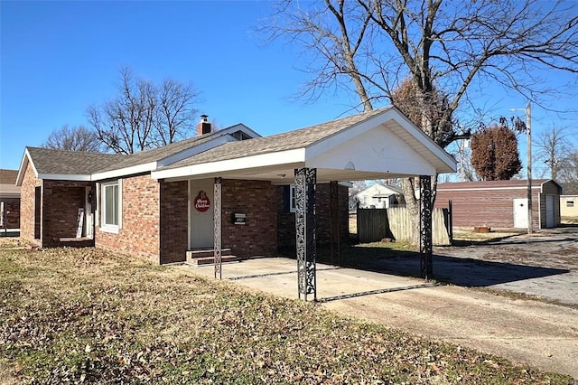 ranch-style house with a carport