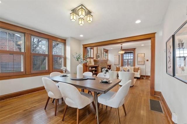 dining space with light wood-type flooring