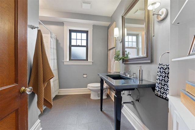 bathroom with sink and toilet