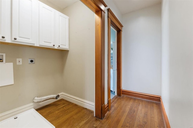 laundry room featuring hardwood / wood-style flooring, electric dryer hookup, cabinets, and washer hookup