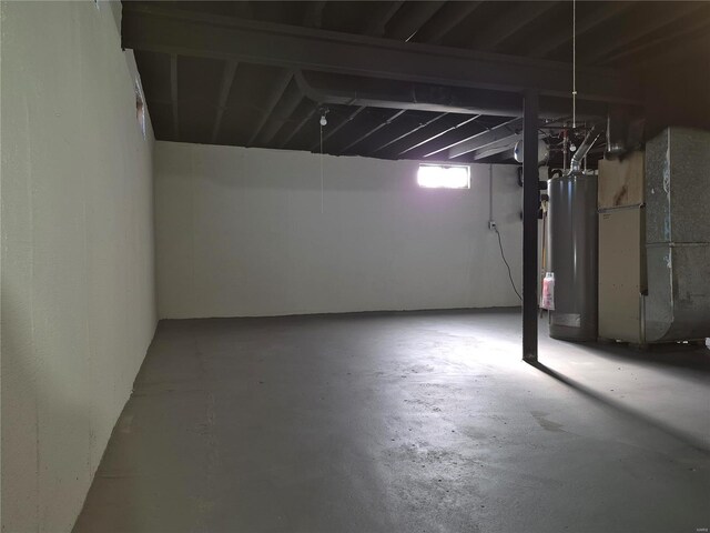 basement with gas water heater and heating unit