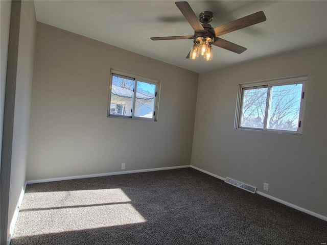 carpeted empty room with ceiling fan