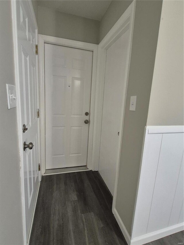 corridor featuring dark hardwood / wood-style flooring