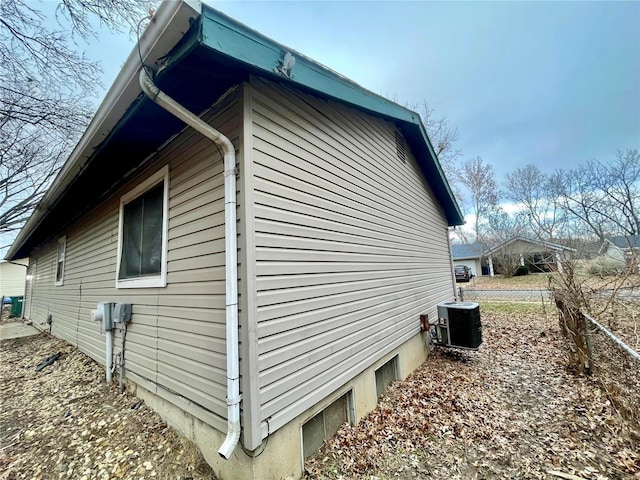 view of side of home with cooling unit