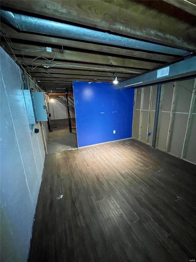 basement featuring hardwood / wood-style flooring