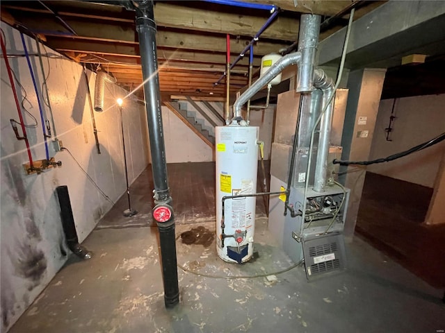 basement with gas water heater and heating unit