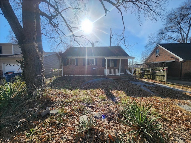 view of front facade with covered porch and a garage