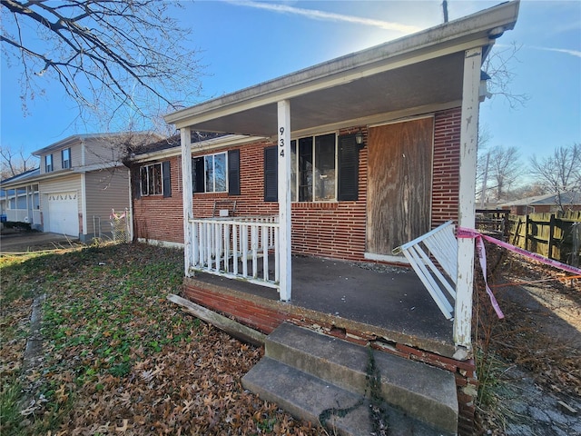 view of front facade featuring a porch and a garage