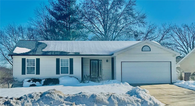 ranch-style house featuring a garage