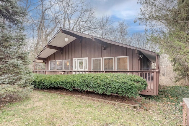 view of property exterior featuring a wooden deck