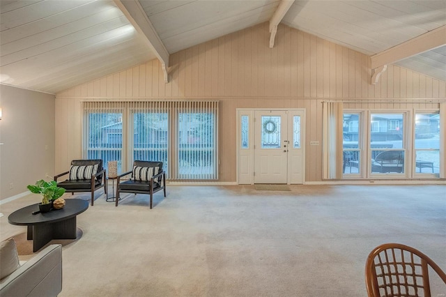 living area featuring light carpet, plenty of natural light, beamed ceiling, and high vaulted ceiling