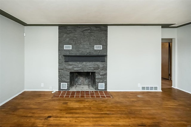 unfurnished living room featuring wood-type flooring and a fireplace