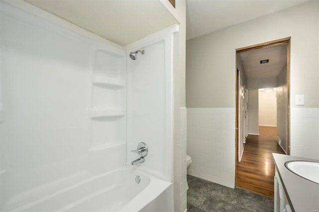 full bathroom featuring vanity, toilet, and tub / shower combination