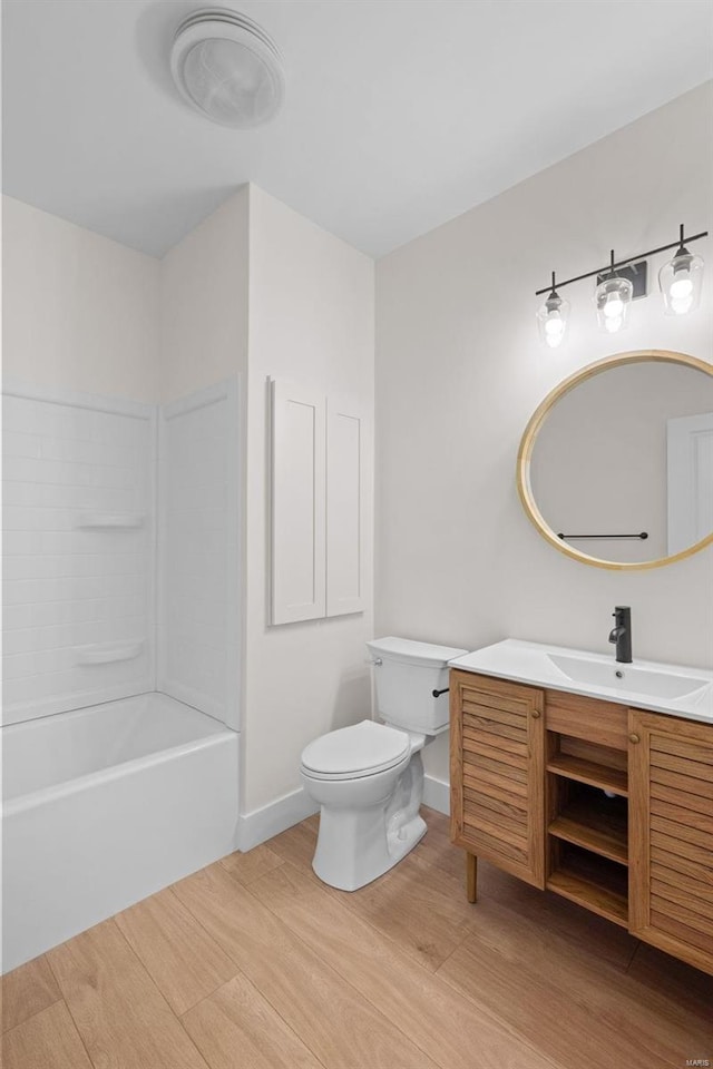 full bathroom with vanity, wood-type flooring,  shower combination, and toilet