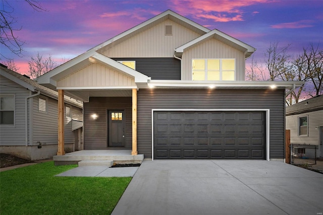 view of front of home with a porch and a garage