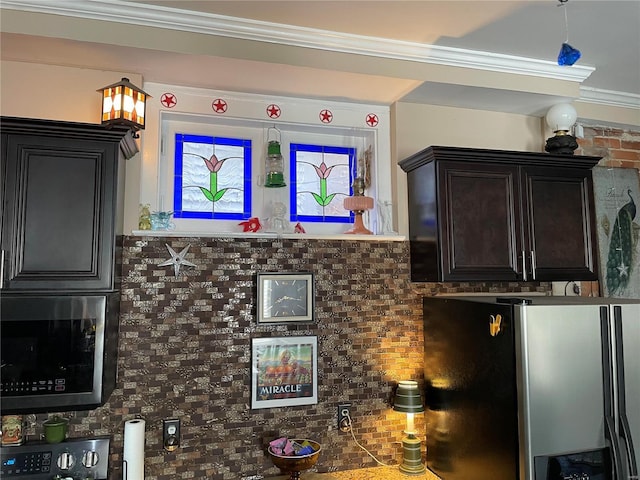 interior space featuring decorative backsplash, appliances with stainless steel finishes, and ornamental molding