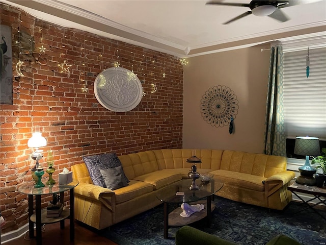 living room featuring ceiling fan, brick wall, and ornamental molding