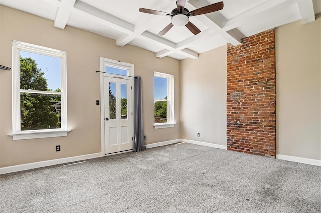 carpeted spare room featuring ceiling fan, beam ceiling, and coffered ceiling