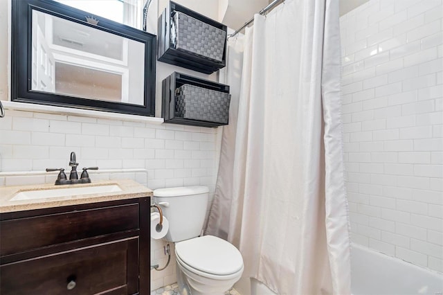 full bathroom with toilet, vanity, tile walls, tasteful backsplash, and shower / bath combination with curtain