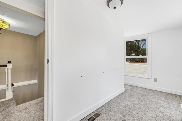 spare room featuring carpet floors