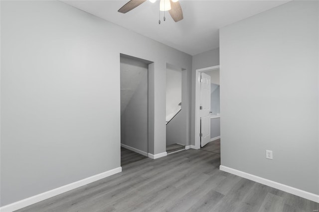 spare room featuring light hardwood / wood-style floors and ceiling fan