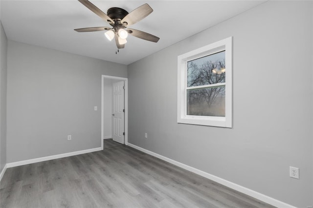 spare room featuring light hardwood / wood-style floors and ceiling fan