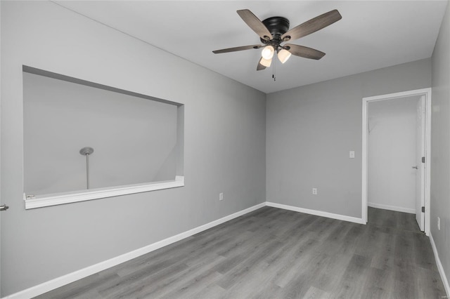 unfurnished room featuring hardwood / wood-style floors and ceiling fan