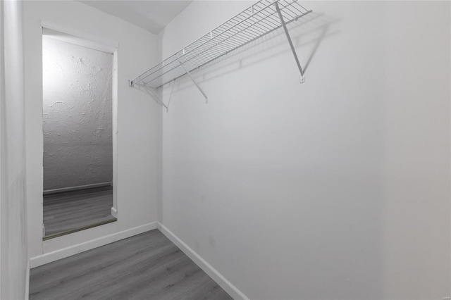 spacious closet featuring hardwood / wood-style floors