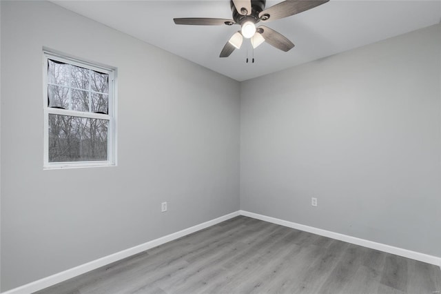 spare room featuring hardwood / wood-style floors and ceiling fan