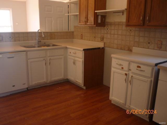 kitchen featuring dishwasher, white cabinets, light hardwood / wood-style flooring, and sink