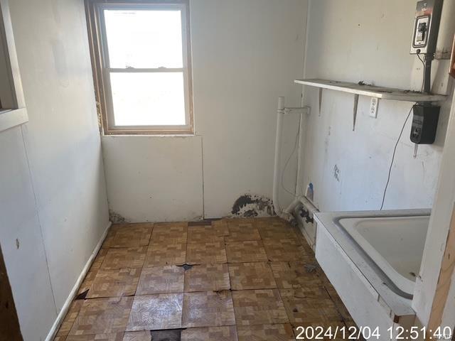 laundry area with plenty of natural light