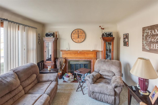 living room with carpet and a fireplace