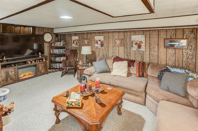 living room featuring carpet and wood walls